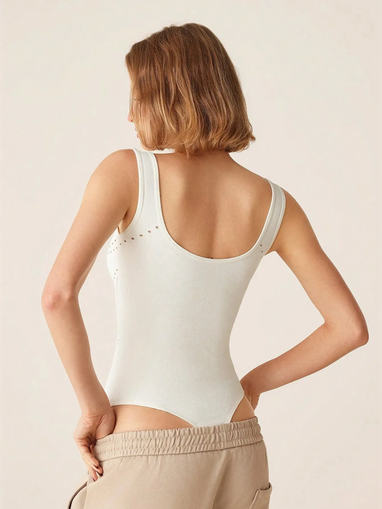 Sleek Hollow-Out Sleeveless Bodysuit – Stylish & Breathable Activewear